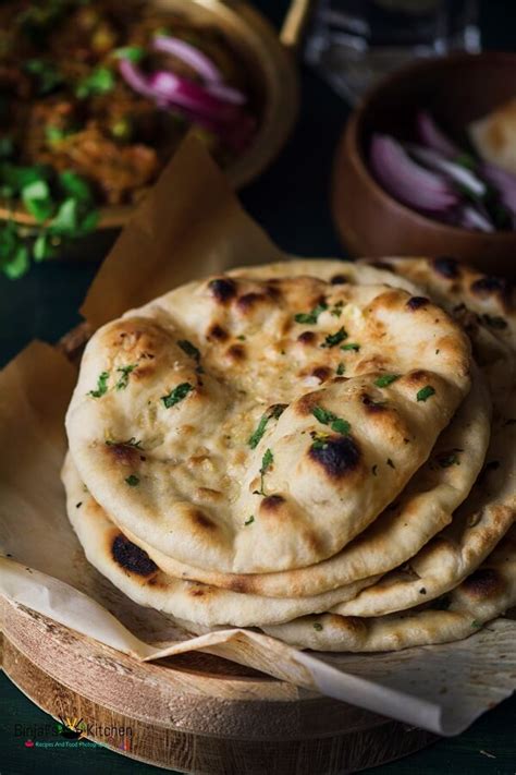 Gently flatten with the palm of your hand into an oval shape, then fold like an envelope. No Yeast Whole Wheat Garlic Naan - Binjal's VEG Kitchen