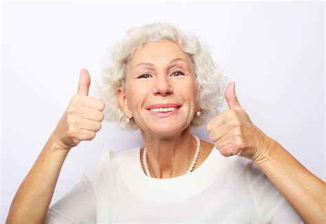 Lifestyle Emotion And People Concept Elderly Happy Woman Giving A Thumb Up And Looking At The