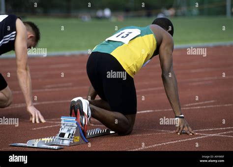 Runner In On Your Marks Position Before 100m Race On An Athletics
