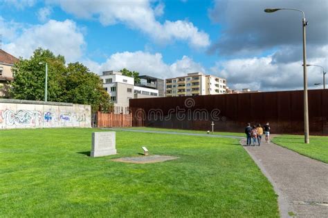 View Of The Berlin Wall Memorial With Tourists Visiting The Exhibition