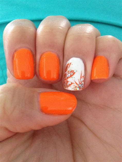 Orange Nails With White Accent Applying The Orange Strokes With A
