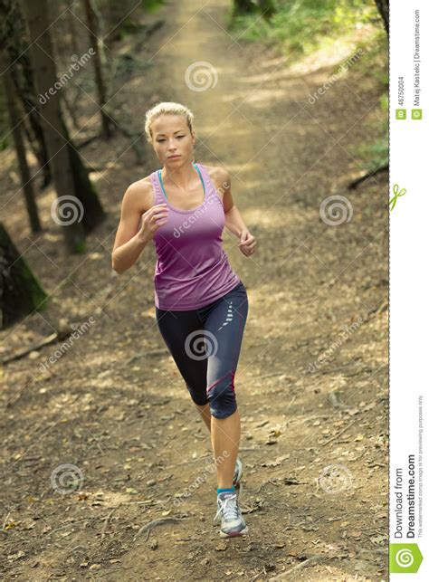 Pretty Young Girl Runner In The Forest Stock Photo