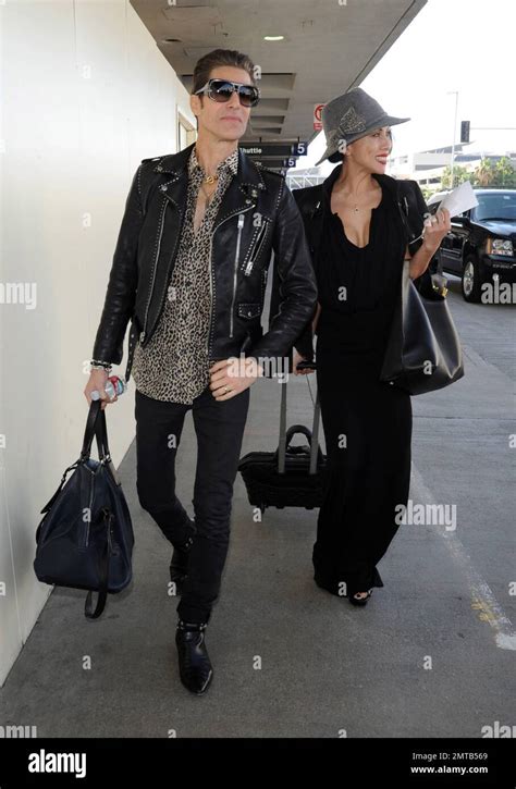 ‘jane s addiction frontman perry farrell and wife etty lau farrell are spotted at lax airport