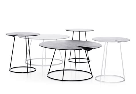 The curved panels of the limited edition breeze table interplay to create asymmetric graphic forms. Breeze Side table by Swedese | STYLEPARK