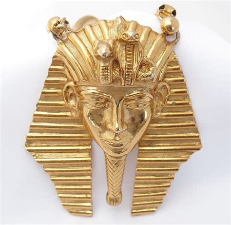 An Egyptian Gold Brooch Depicting The Head Of Pharaoh Tutane