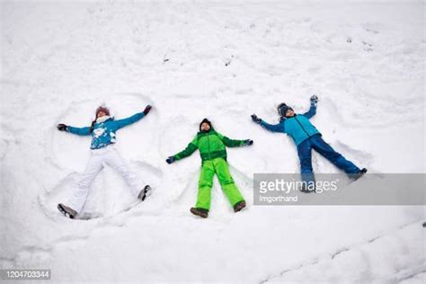 Kids Making Snow Angels Photos And Premium High Res Pictures Getty Images