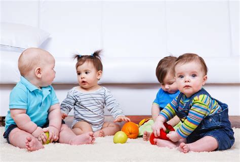 Four Babies Group Sitting On The Floor Sproutlings Childcare