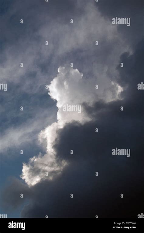 Rain Threatening Clouds With A Cumulus Cloud In The Sky Stock Photo Alamy