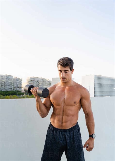 Athletic Muscular Shirtless Guy Doing Fitness Exercise With Dumbbell