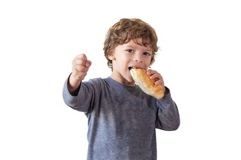 Premium Photo Young Boy With Bread