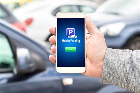 Parking apps let you bypass confusing payment kiosks and annoying tickets. Mobile Parking App On Smartphone Screen Facing Camera Man ...