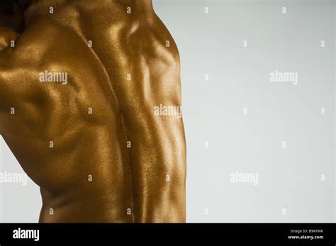Rear View Of A Man Flexing Muscles Stock Photo Alamy