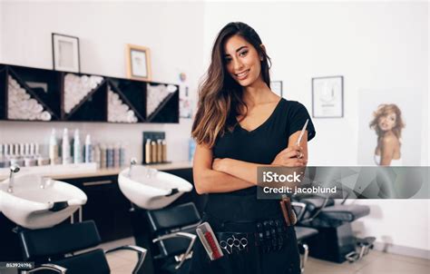 Female Hairdresser Standing In Salon Stock Photo Download Image Now
