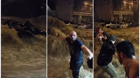 Incredible Moment Locals Form Human Chain To Save Woman From Flood