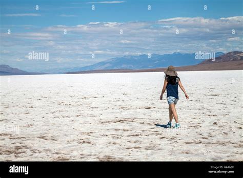 Woman Walking In The Middle Of The Badwater Basin Death Valley