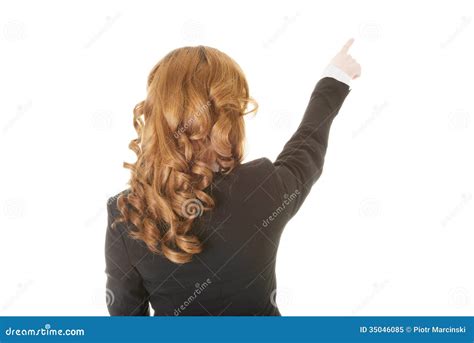 Beautiful Woman Standing And Pointing Up Back View Stock Image