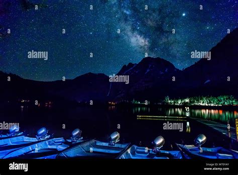 Starry Night Sky With Milky Way Mountains And Boats Stock Photo Alamy