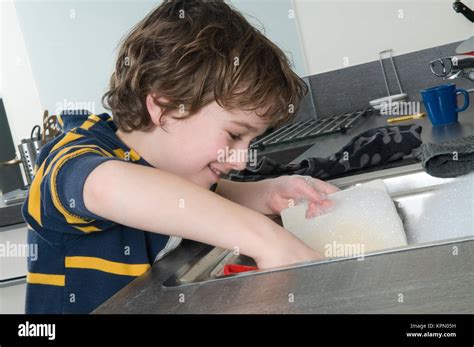 Doing The Dishes Stock Photo Alamy