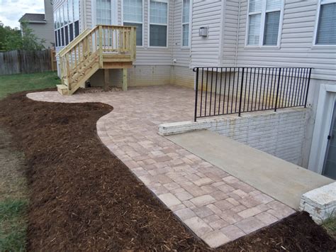 Crisp and smooth paving stones pair great with artificial grass and putting greens. brick paver patio and deck in fredericksburg va | Stafford ...