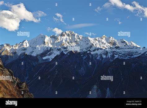 Brown Hills And Snow Capped Mountains Of The Himalayas Stock Photo Alamy