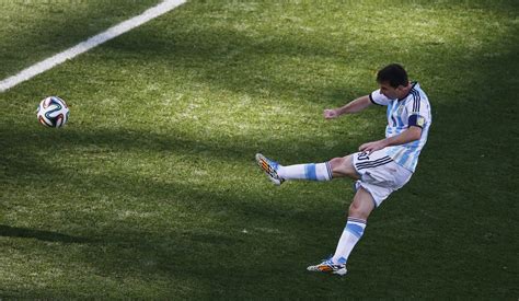 Argentinas Messi Kicks The Ball During Their 2014 World Cup Round Of