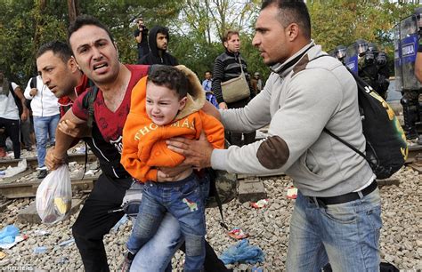 Macedonian Police Fire Tear Gas At Migrants Trying To Cross The Greece