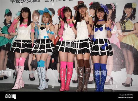 Members Of Japanese Pop Idol Girl Group Morning Musume Wave At A