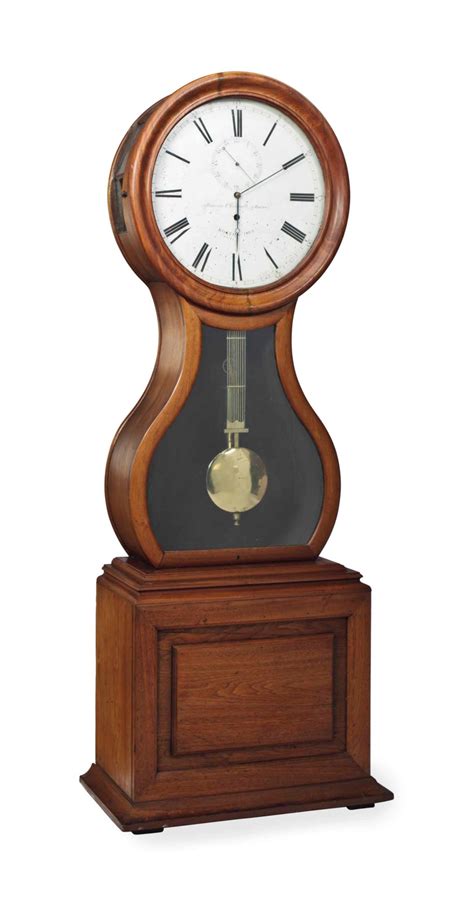 An American Walnut Tall Case Clock