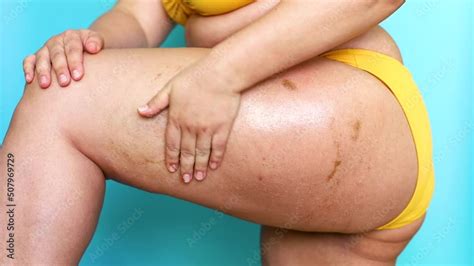 Stockvideon Side View Of Unrecognizable Fat Plump Woman Stand In Yellow