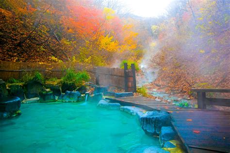 Japanese Hot Springs Onsen Natural Bath Surrounded By Red Yellow Leaves