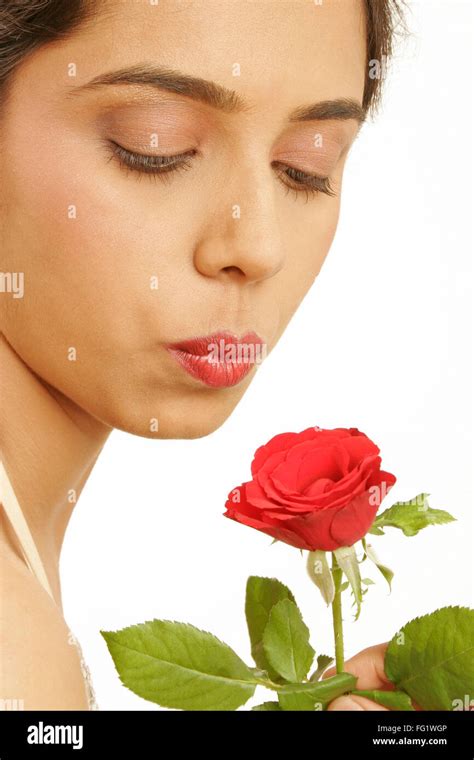 South Asian Indian Teenage Girl Trying To Give Kiss To Red Rose Mr671