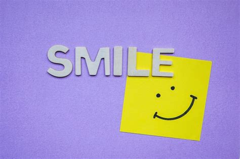 Premium Photo Smile Word With Wooden Letters On The Purple Background