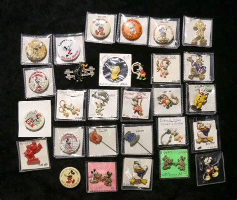 5101 A Collection Older Disney Character Pin Backs And Charms