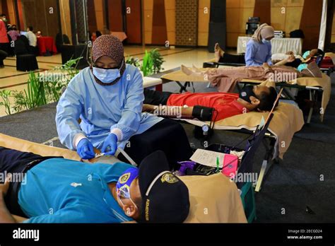 Blood donor at donation, transfusion. Close up right arm of a business