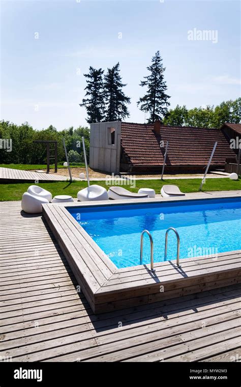 Beautiful Outdoor Skimmer Swimming Pool With Wooden Flooring Steel