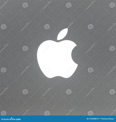 Macro Shot Of Macbook Pro Backlit Apple Logo Brushed Aluminium Texture