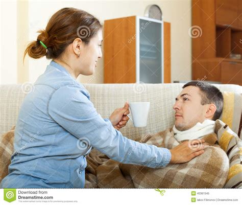 Woman Caring For Sick Husband Stock Image - Image of caring, medication: 40361545