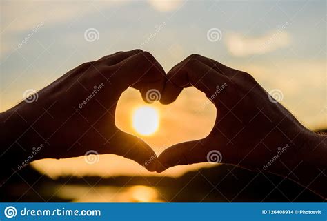 Heart Gesture In Front Of Sunset Above River Summer Memories Concept