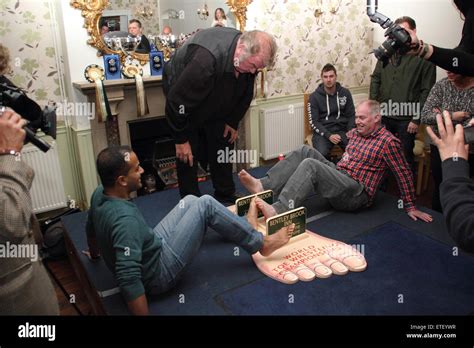 Competitors Lock Toes At The 39th World Toe Wrestling Championships