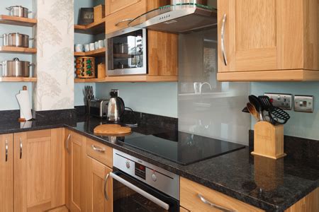 After you have successfully removed all of the grease from the cabinets, repeat the steps above to rinse and dry them off. Easy Clean Kitchen Ideas | Solid Wood Kitchen Cabinets Blog