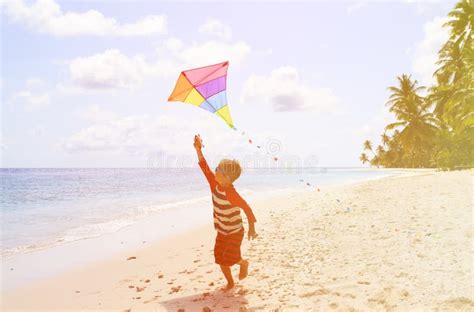 Little Boy Flying A Kite On Tropical Beach Stock Image Image Of Play