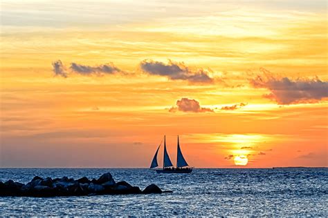 Serene Sunset Sail A Sailboat Enjoys The Fabulous Key West Sunset