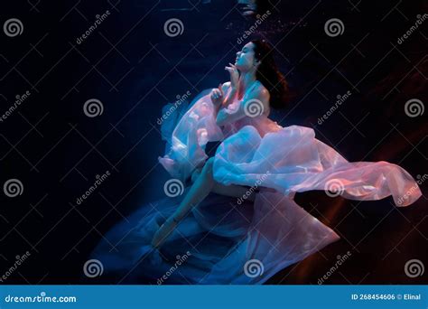Gorgeous Sensual Model Ballerina Swimming Underwater In Fluttering Dress Soft Blurred Focus