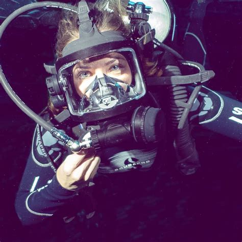 A Woman Wearing A Diving Mask And Breathing Apparatus