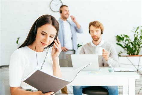 Happy Broker Touching Headset While Holding Stock Photo Image Of