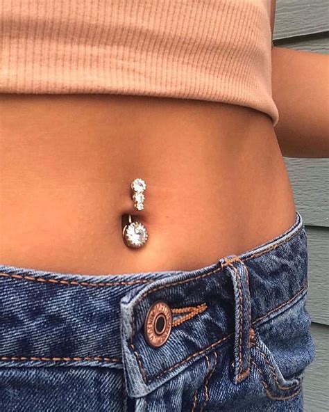 A Multi Gem Belly Button Piercing Is A Bold And Shiny Idea For A Modern