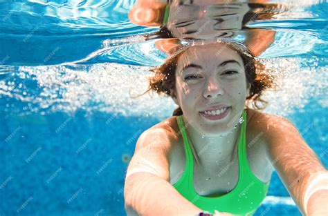 Premium Photo Child Swims Underwater In Swimming Pool Happy Active