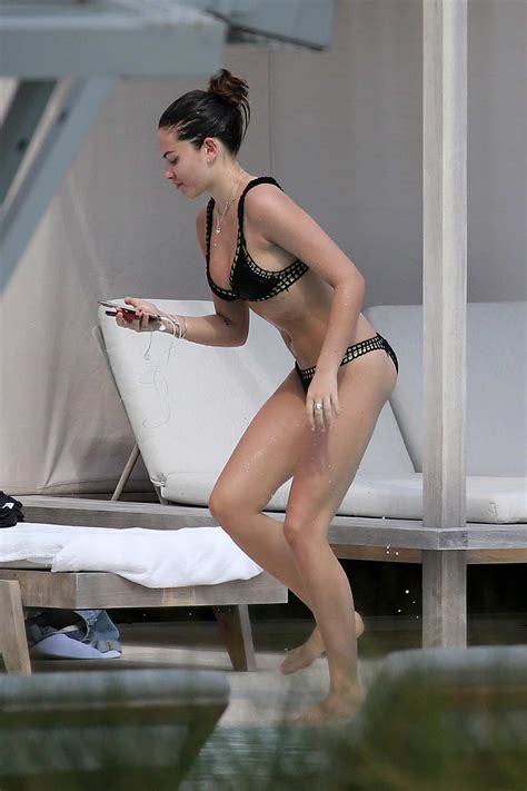 Thylane Blondeau Seen Relaxing By Hotel Pool Wearing A Black Bikini And