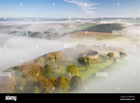 Aerial View By Drone Of Restormel Castle On A Misty Autumn Morning