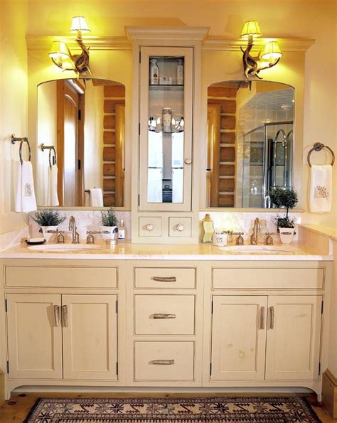 Double Sinks With A Cream Color And Middle Cabinet Very Clever